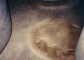 Flamed granite exterior floor before restoration. Before image of flamed granite restoration