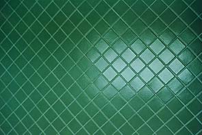 Restroom Ceramic Tile restoration by International Stoneworks. Green Ceramic Tile in Restroom After Restoration