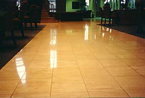 Travertine floor after being polished by International Stoneworks. Polished Travertine floor.