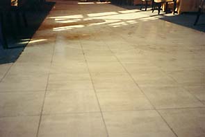 Travertine floor before restoration by International Stoneworks. Travertine floor before restoration